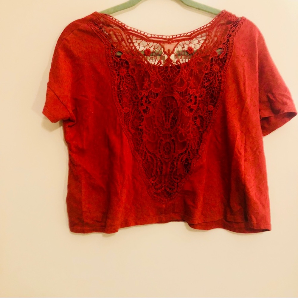 Reddish orange crop top with open back